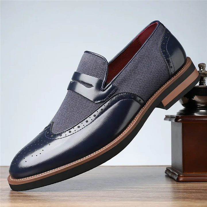 Modern men's hybrid wingtip loafers, comfortable brown slip-on shoes for a refined dress casual style.