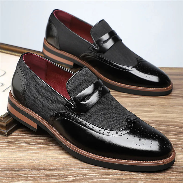 Men's black hybrid loafers, sophisticated slip-on shoes featuring a modern wingtip design & comfort.