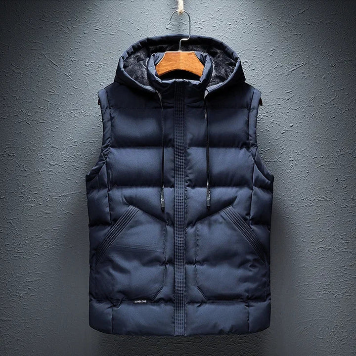 Men's insulated hooded puffer vest, providing streamlined warmth and modern casual style for winter layering.