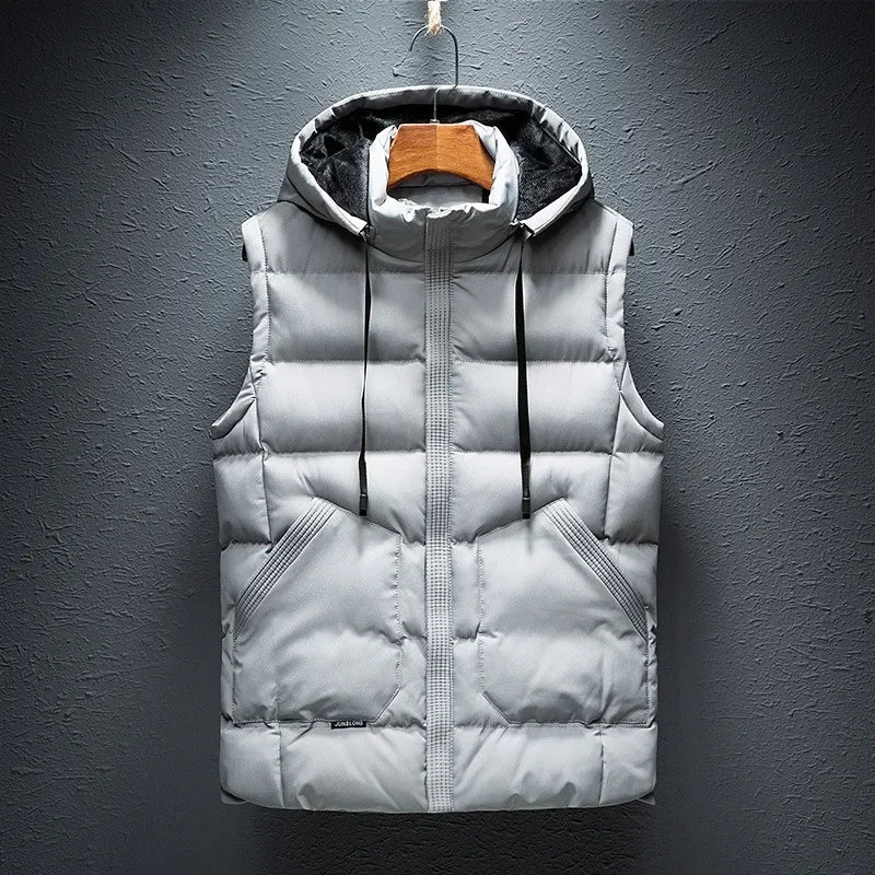 Close-up of a men's hooded puffer vest, showcasing the durable, weather-resistant fabric and cozy insulation.