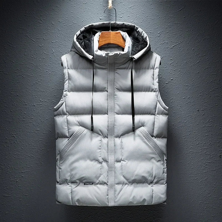 Close-up of a men's hooded puffer vest, showcasing the durable, weather-resistant fabric and cozy insulation.
