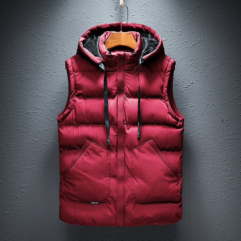 Man wearing a versatile men's hooded puffer vest, ideal as a sleeveless jacket for casual layering and warmth.