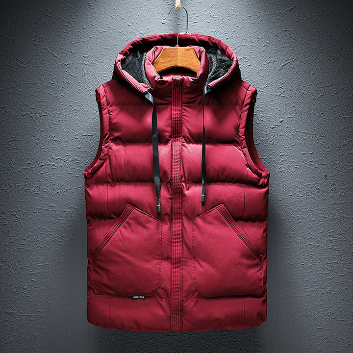 Man wearing a versatile men's hooded puffer vest, ideal as a sleeveless jacket for casual layering and warmth.