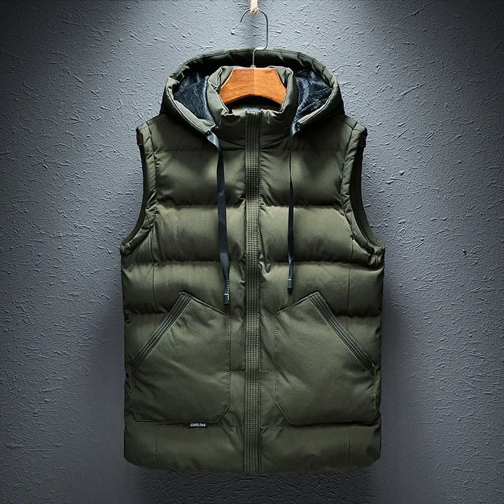 Stylish dark gray men's hooded puffer vest, a warm layering piece perfect for diverse outdoor activities.
