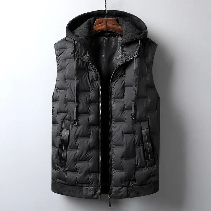 Warm men's winter vest with insulation and practical detachable hood. Ideal for hiking & travel.
