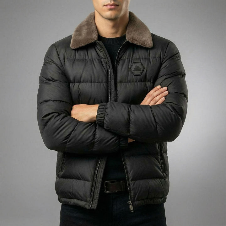 Heavy-duty men's insulated puffer jacket providing warmth and protection in extreme cold winter conditions. Outdoor ready.