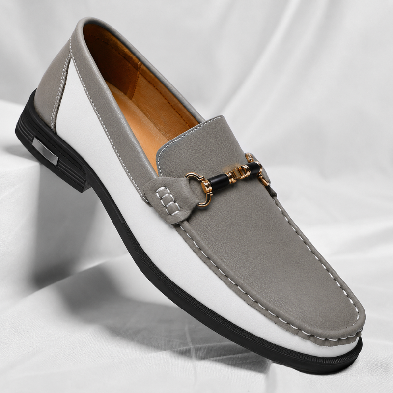 Close-up of elegant men's Italian loafers, showcasing fine craftsmanship and sleek style.
