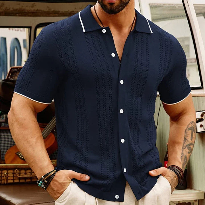 Full shot of men's jacquard knit short sleeve button-up shirt, showcasing breathable fabric & design.