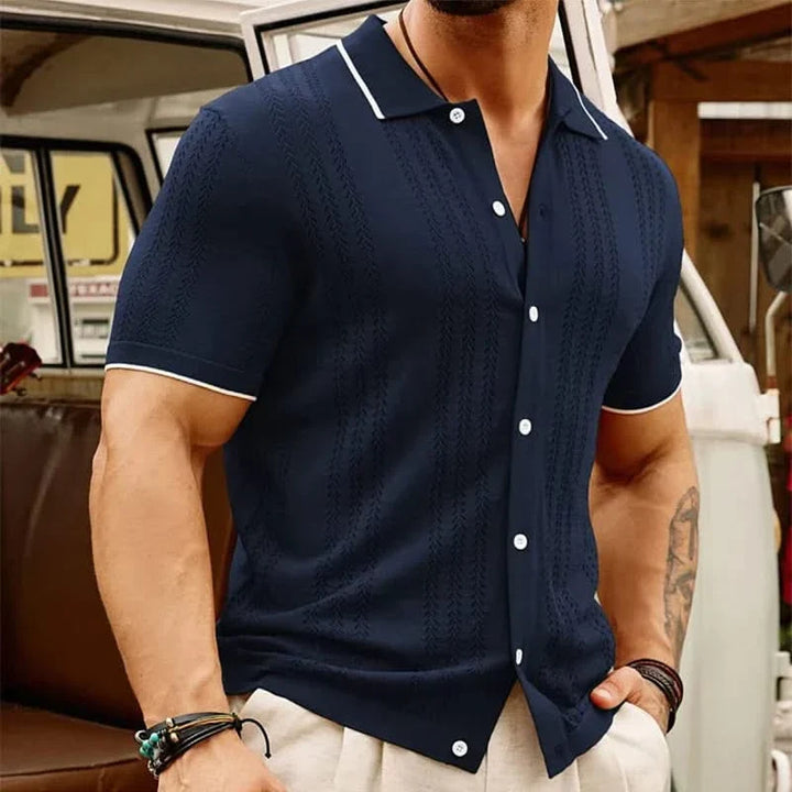 Front view of a stylish men's jacquard knit short sleeve button-up shirt. Textured fabric, perfect for summer casual.