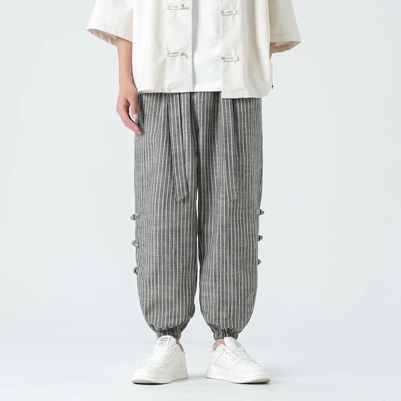 Beige men's Japanese streetwear pants. Comfort loose fit, stylish side stripe. Urban fashion casual trousers.