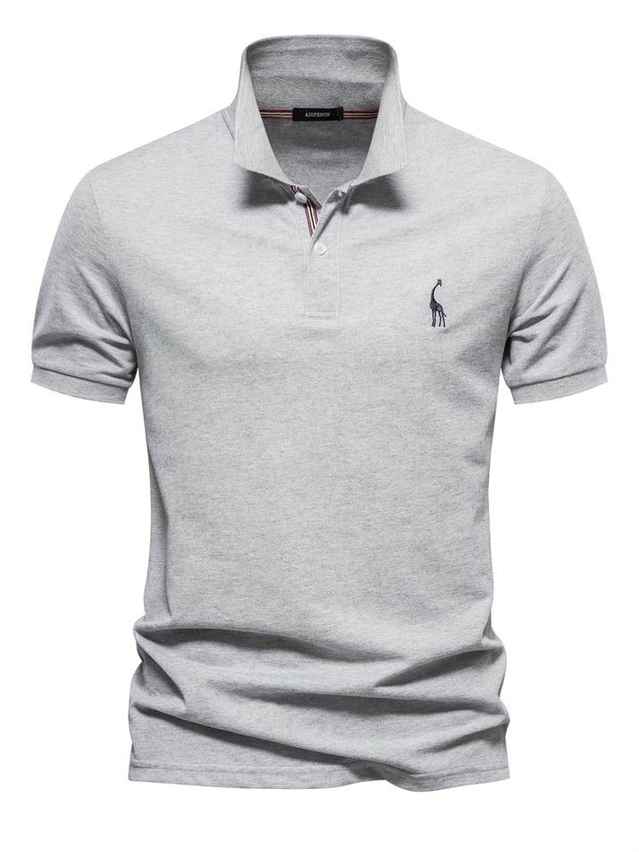 Close-up of a stylish men's Jasper polo shirt, highlighting refined texture & comfort for casual wear.