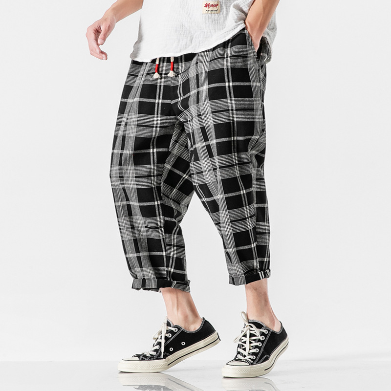 Men's Kaizen Grid tapered ankle pants with a relaxed fit, ideal for modern casual and streetwear styles.