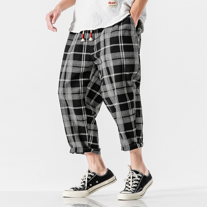 Men's Kaizen Grid tapered ankle pants with a relaxed fit, ideal for modern casual and streetwear styles.