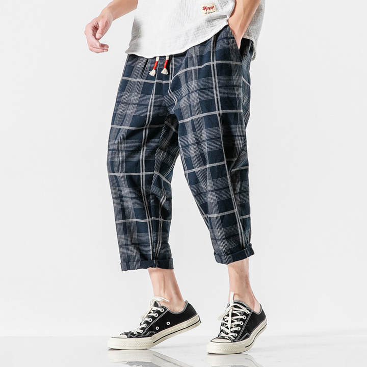 Stylish men's Kaizen Grid tapered ankle pants, perfect for casual wear, streetwear, offering a modern, relaxed fit.