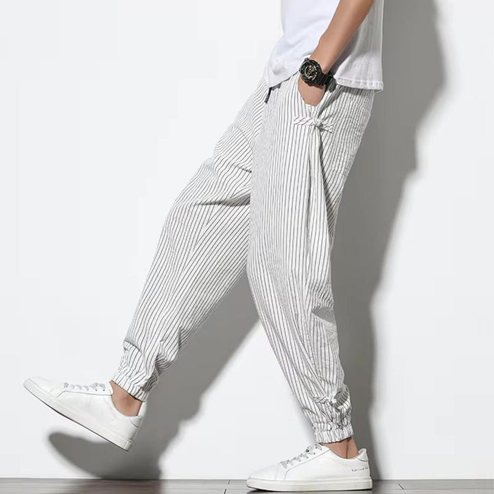 Soft men's striped lounge pants, Kaizen comfort joggers, essential casual apparel.