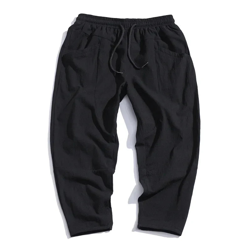 Stylish men's Katachi cropped pants, tapered modern fit, adjustable waist for versatile casual comfort.