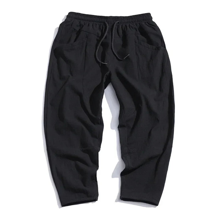Stylish men's Katachi cropped pants, tapered modern fit, adjustable waist for versatile casual comfort.