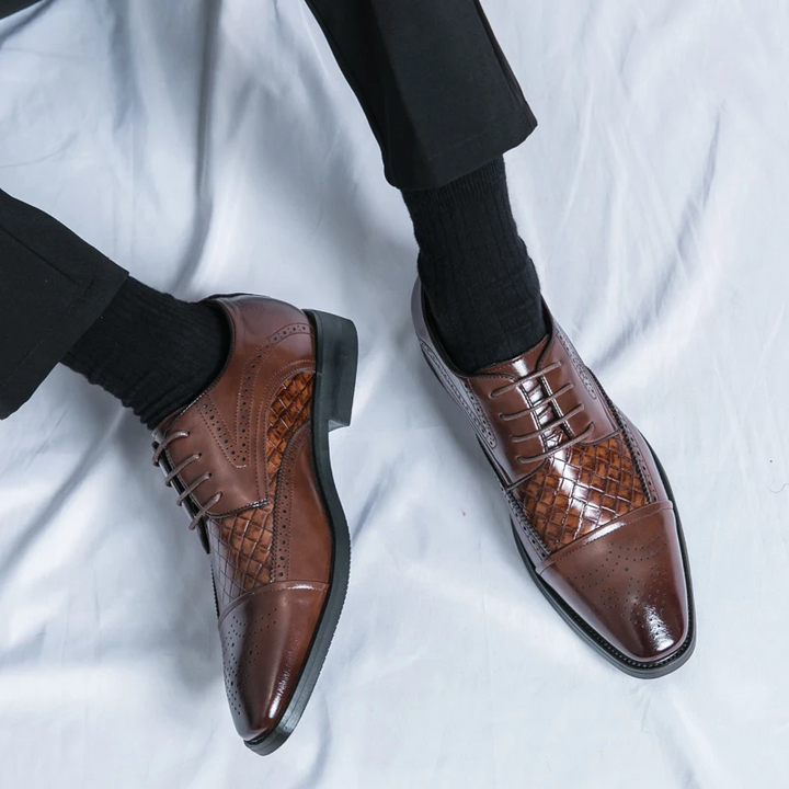 Men's elegant brogue dress shoes worn with business attire, showcasing their sophisticated and classic style.