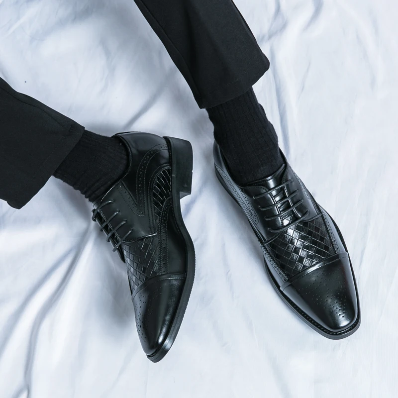Close up of the premium leather texture on men's sophisticated Kensington brogue dress shoes.