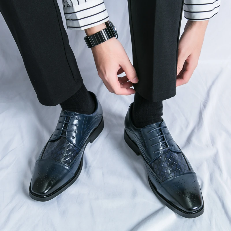Side view of classic men's formal brogue shoes, ideal elegant footwear for business and dress occasions.
