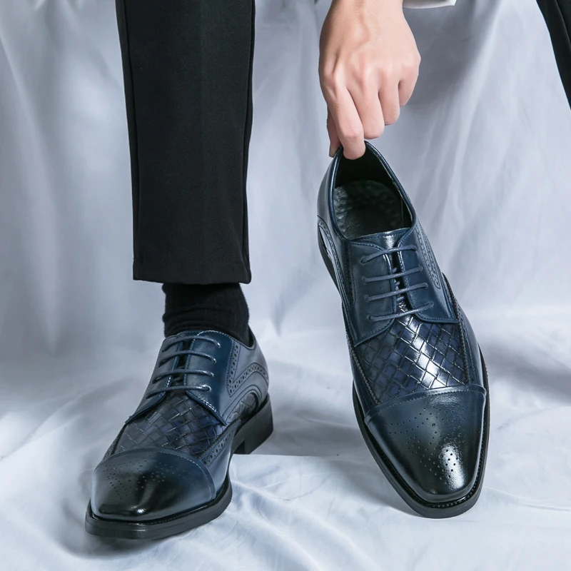 Pair of luxurious men's oxford brogue dress shoes, perfect for sophisticated business attire and formal events.