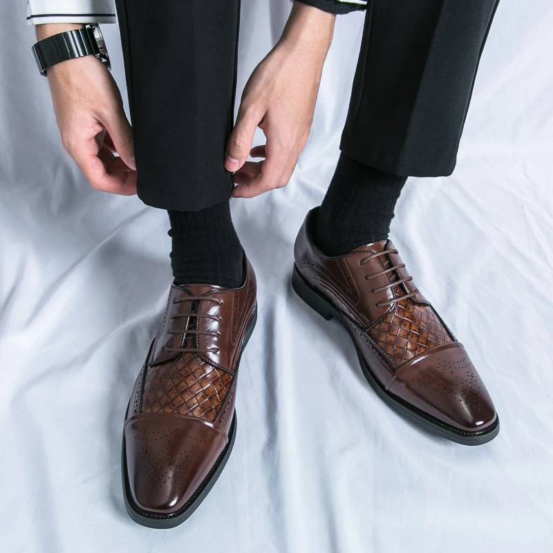 High-angle view of men's Kensington brogue dress shoes, capturing their classic style and polished finish.