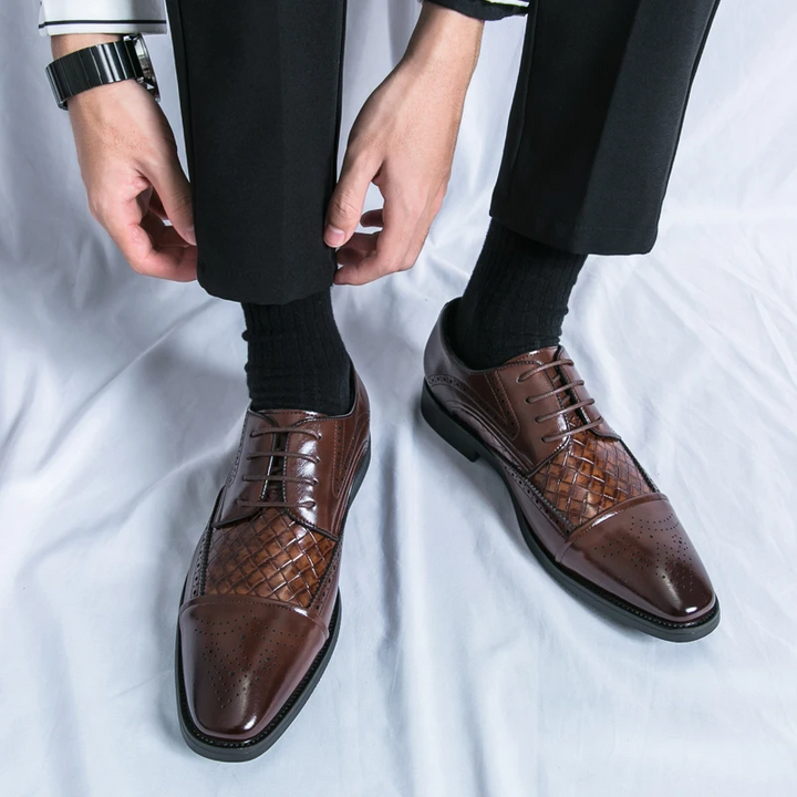 High-angle view of men's Kensington brogue dress shoes, capturing their classic style and polished finish.