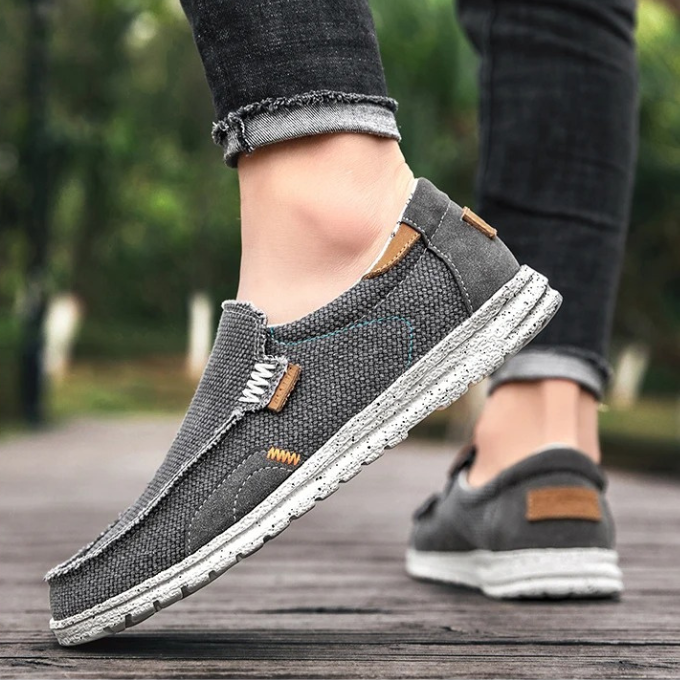 Men's casual canvas slip-on shoes in a versatile khaki color. Comfortable Dockstone flats.