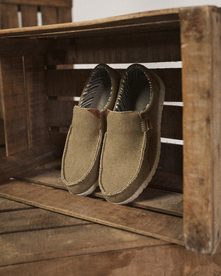 Close-up of men's casual canvas slip-on shoe, highlighting comfortable design & easy wear.