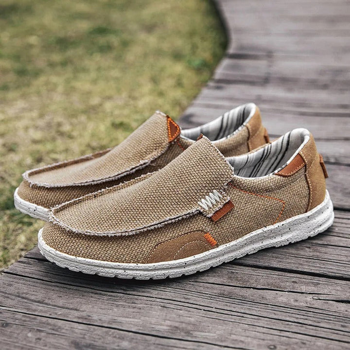 Side view: Men's khaki canvas slip-on shoe, ideal for walking & everyday comfortable wear.
