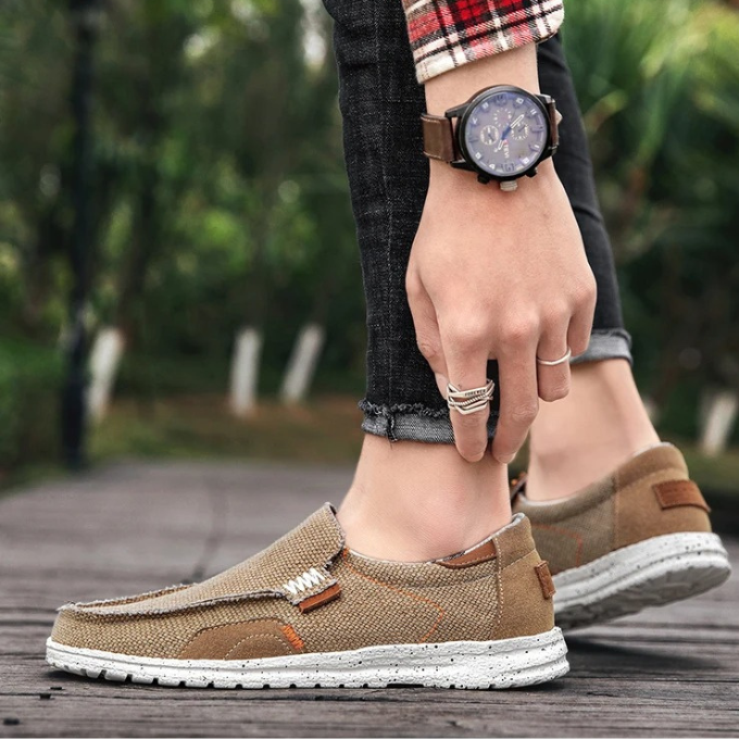 Men's Dockstone Comfort slip-on canvas shoes in blue, designed for casual spring & summer style.