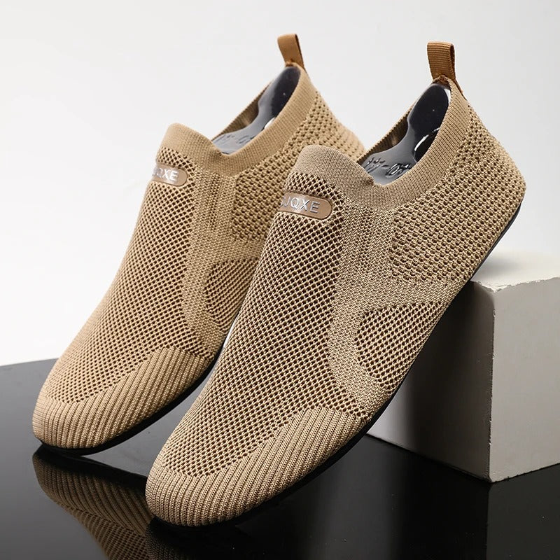 Close-up of khaki knit men's slip-on shoe texture. Breathable, lightweight fabric for comfort.