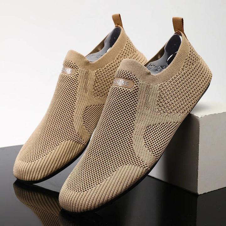 Close-up of khaki knit men's slip-on shoe texture. Breathable, lightweight fabric for comfort.