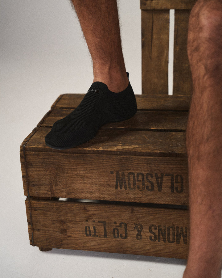 Comfortable men's knit slip-on shoes. Barefoot feel, breathable for all-day wear.
