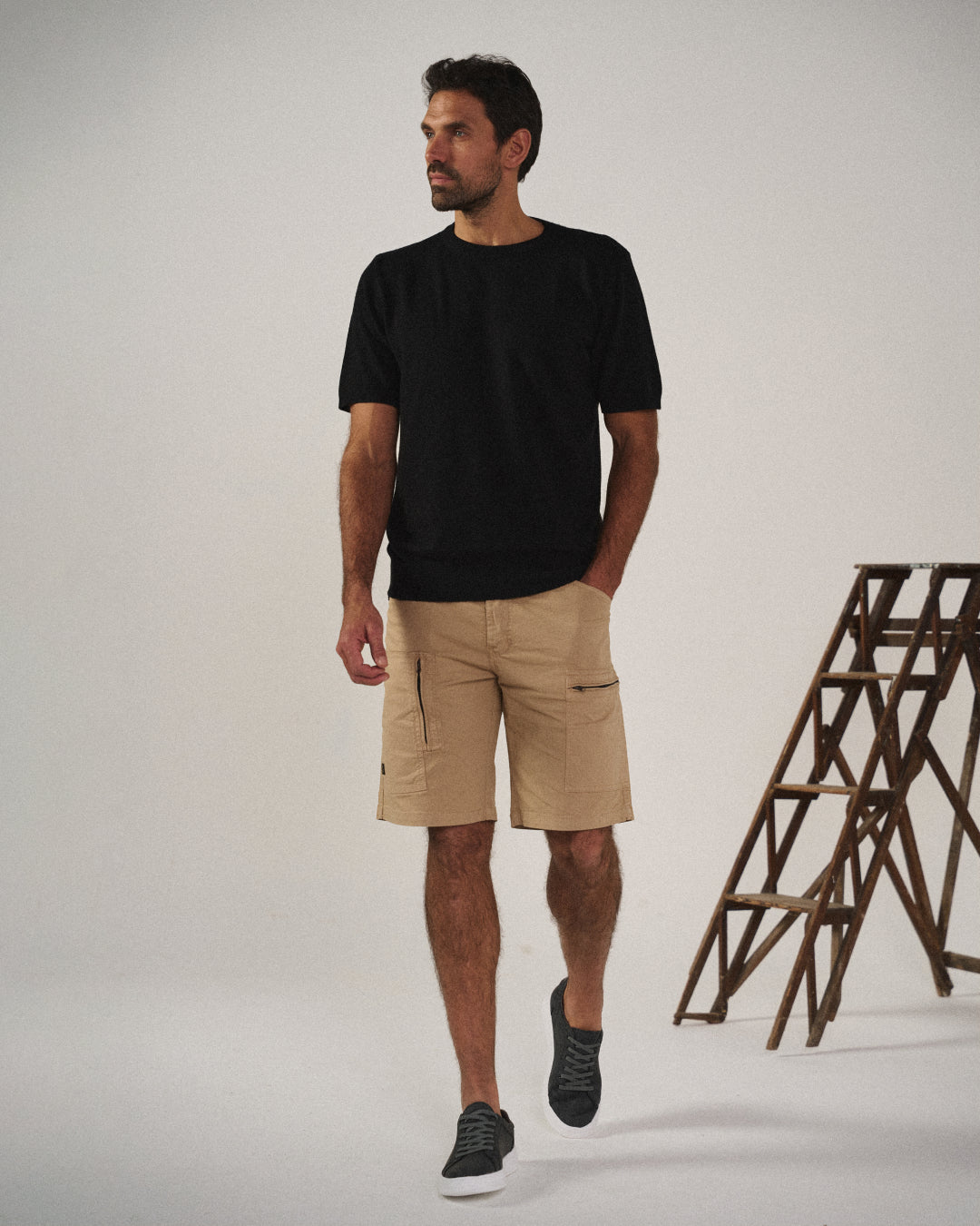 Khaki knit men's slip-on shoes, side view. Lightweight, flexible, and easy wear design.