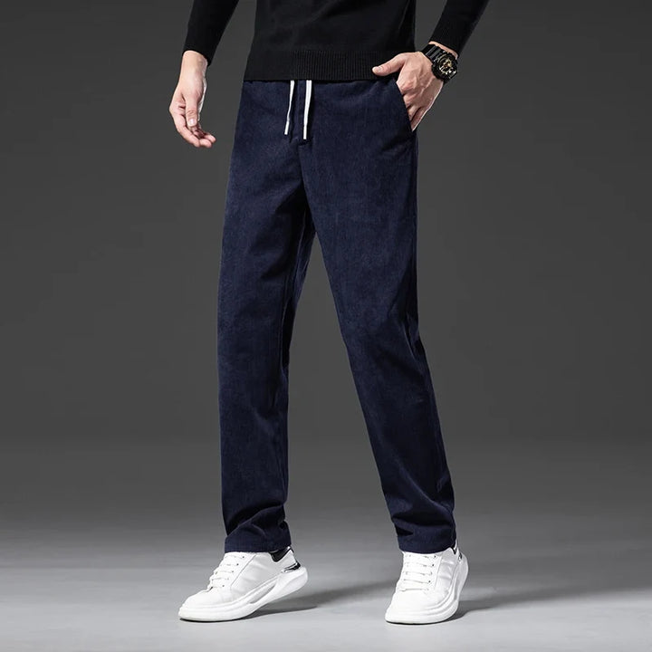 Dark gray men's relaxed fit comfort pants with elastic waist, ideal for casual style.
