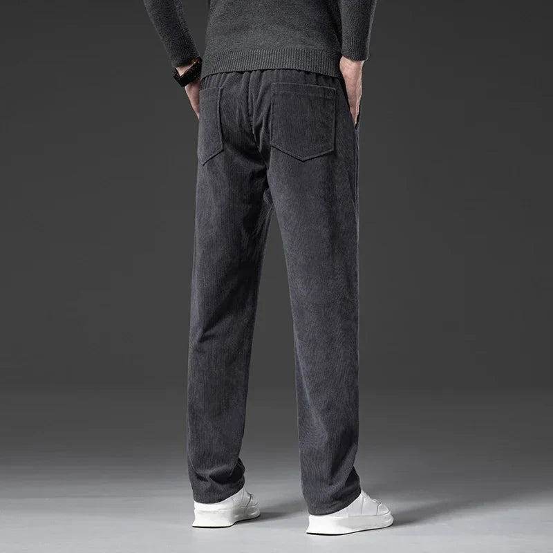 Black men's casual pants with elastic waist, relaxed fit for ultimate comfort and style.