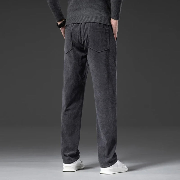Black men's casual pants with elastic waist, relaxed fit for ultimate comfort and style.