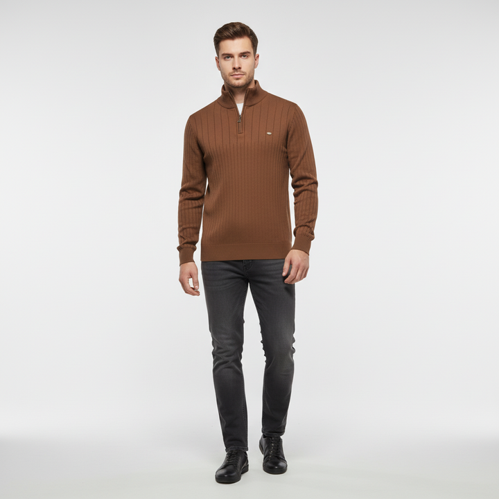 Lifestyle shot of a man in a knitted zip collar sweater, a warm casual cotton blend for any season