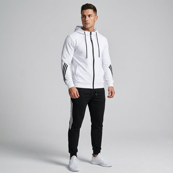 Front view of a male model wearing the Kyle men's athletic tracksuit in green, showcasing its relaxed fit.