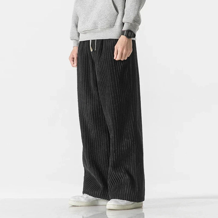 Versatile men's minimalist pants, Japanese style. Relaxed straight leg fit, perfect for diverse daily outfits.