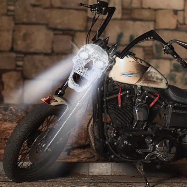 High-quality LED motorcycle headlight featuring a distinctive skull head design for custom biker lighting.