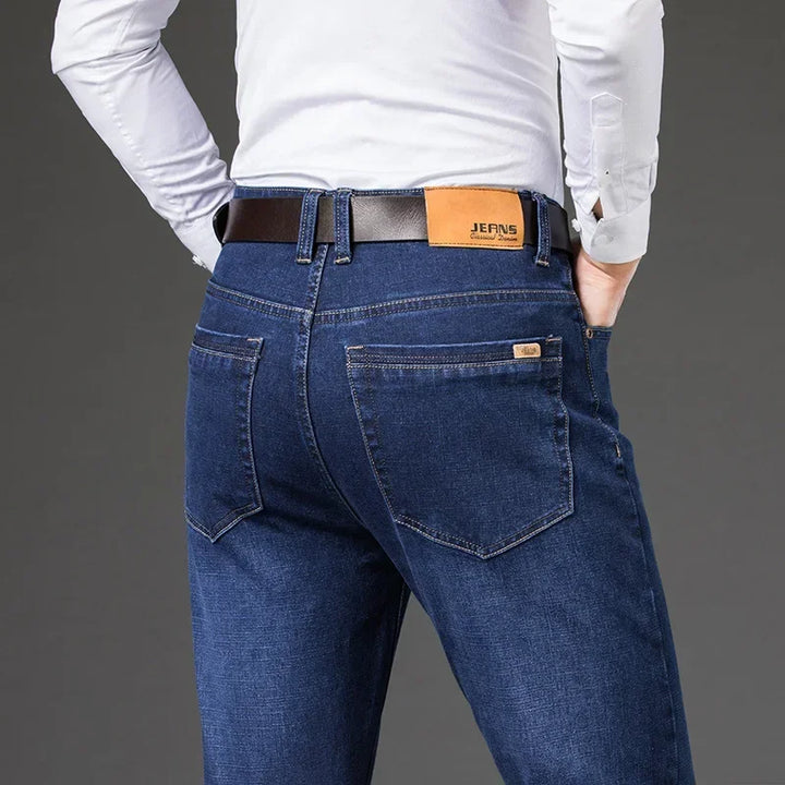 Men's Legacy straight leg stretch denim jeans in classic blue wash, comfortable for everyday wear.