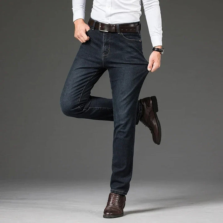 Stylish men's blue Legacy stretch denim jeans, straight leg cut, durable for versatile daily outfits.
