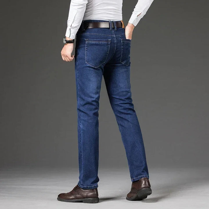 Sleek men's black Legacy straight leg stretch denim jeans, versatile casual pants for modern fashion.