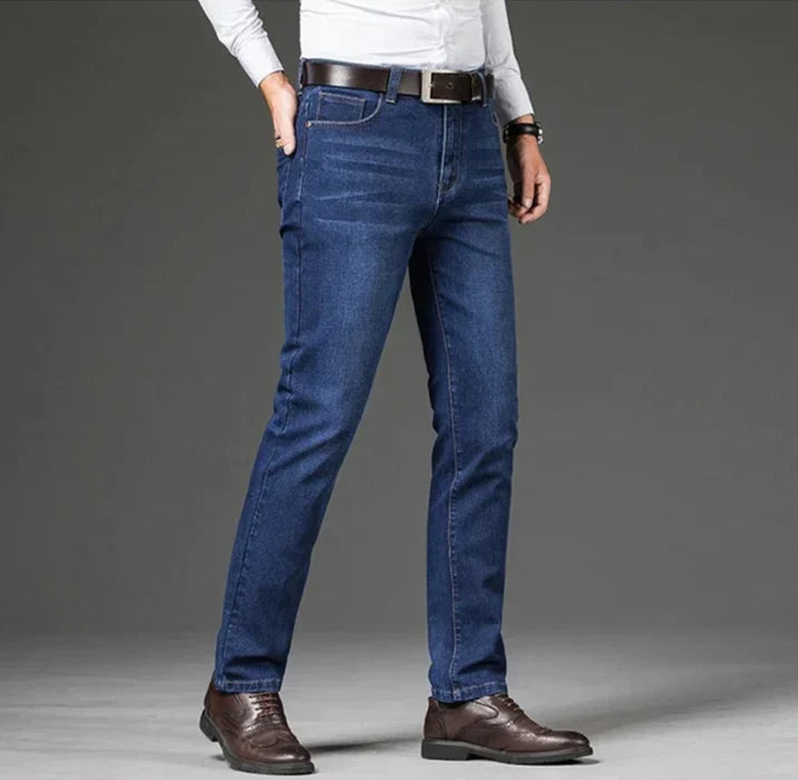 Comfortable men's blue stretch denim travel jeans, straight leg style, durable for active days.