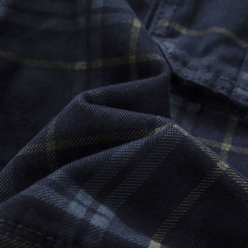 Men's lightweight check pattern adventure cargo shorts, folded neatly, showcasing fabric and design.