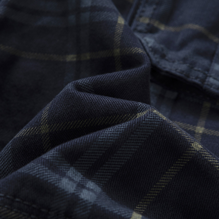 Men's lightweight check pattern adventure cargo shorts, folded neatly, showcasing fabric and design.