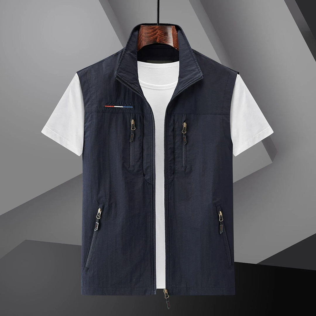 Men's lightweight adventure utility vest with multiple zip pockets, ideal for hiking & travel.