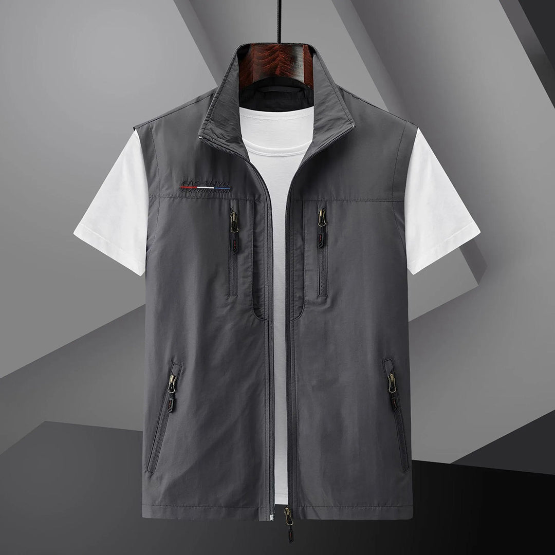 Lightweight men's travel utility vest with secure zip pockets, perfect for outdoor activities & fishing.